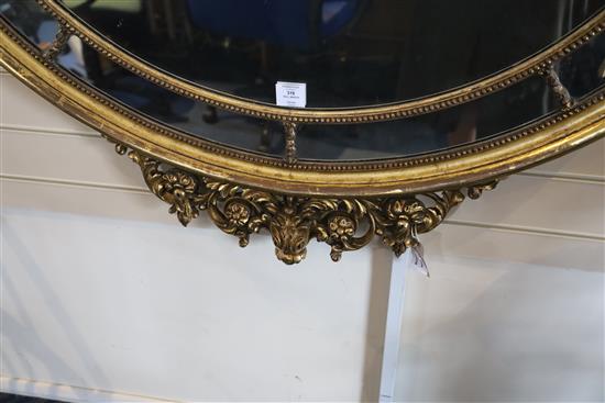 A mid 20th century carved giltwood wall mirror, W.3ft 9in. H.4ft 8in.